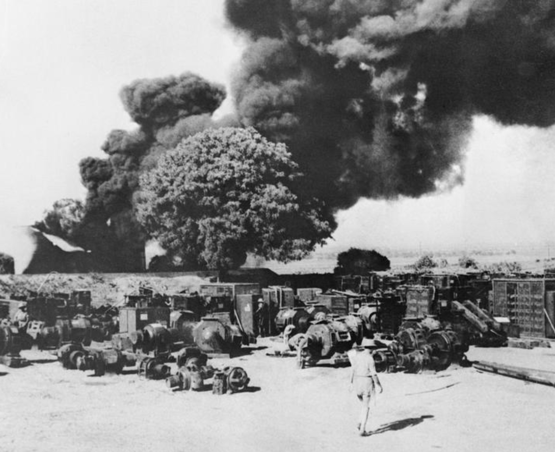 Electrical equipment and oil installations at Yenanguang being destroyed as part of the "scorched earth" policy, in the face of the Japanese advance. 